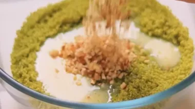 Pistachio modaks drizzled with melted chocolate on a festive plate 1